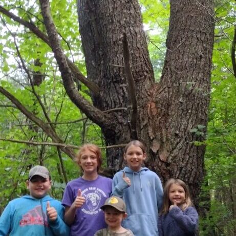 December 2024 | Cody Akey | Youth Approved | This young bear looks over these Youth hunters. The future of our sport all in one photo!